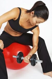 Use a gym ball for workouts that can be done from a seated position