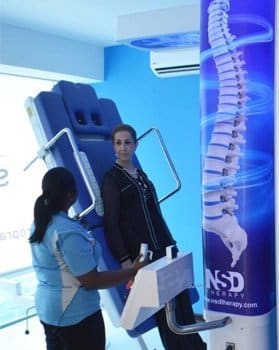 lady getting RxDecom treatment for slip disc in Kuala Lumpur