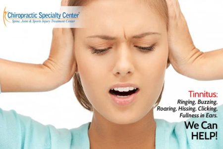 women with tinnitus and ringing,holding ears in agony