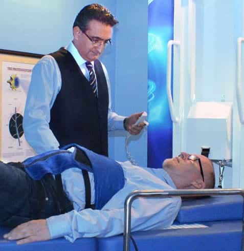 Dr. Yama providing spinal decompression therapy via the RxDecom & NSD Therapy
