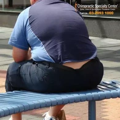 overweight man sitting
