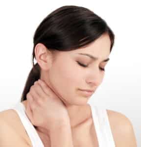 Female with neck discomfort (cervicalgia) holding neck and upper back