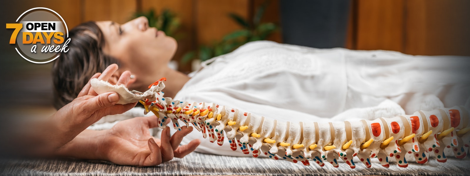 chiropractic-bandar-sri-damansara-kuala-lumpur hero banner showing spine model and non-invasive chiropractic care available seven days a week